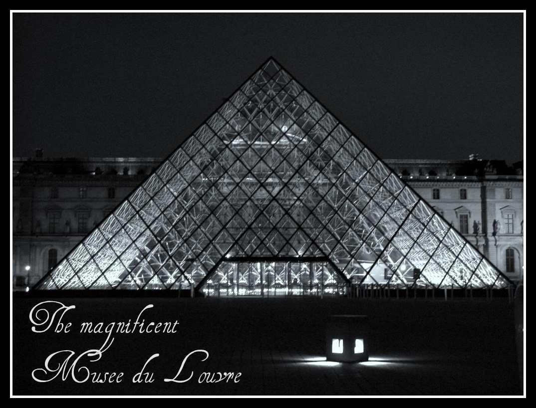 Louvre glowing triangle at night in Paris