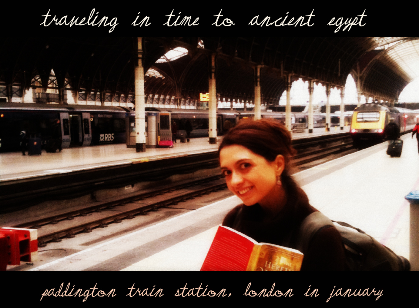 Reading The Heretic Queen in London Paddington Station